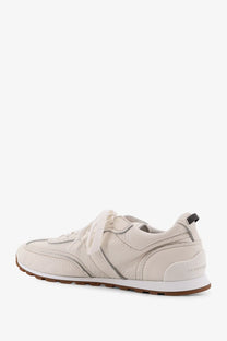 Brunello cucinelli women’s leather sneakers in cream with subtle stitching and brown rubber sole for casual wear