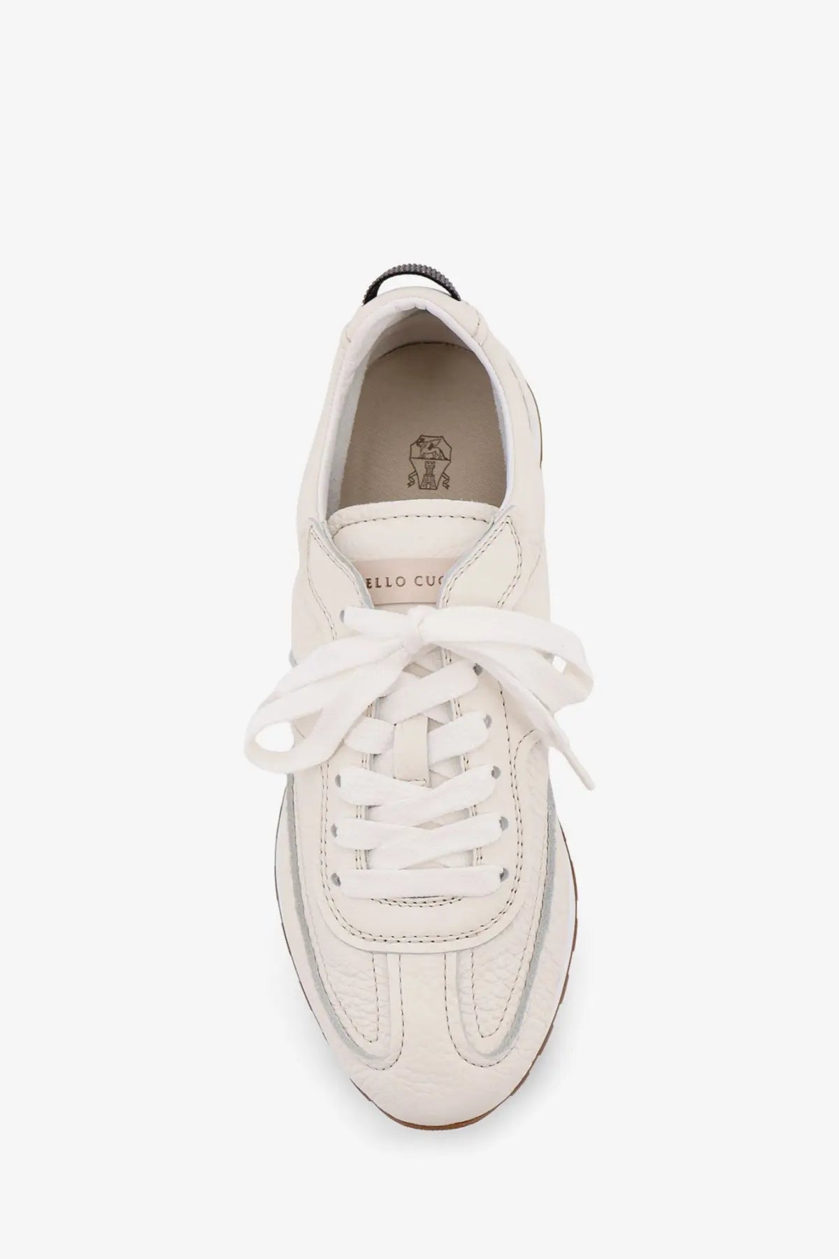 Brunello Cucinelli women’s white leather low-top sneakers with clean minimalist design and matching white laces
