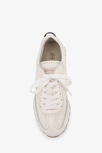 Brunello Cucinelli women’s white leather low-top sneakers with clean minimalist design and matching white laces