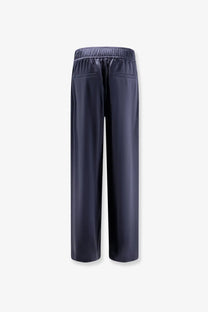 Dark navy silk satin trousers with elastic waistband and two back pockets shown from the back by brunello cucinelli women