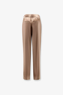 Beige satin brunello cucinelli women’s silk trousers with elastic waistband and two back pockets shown from the back