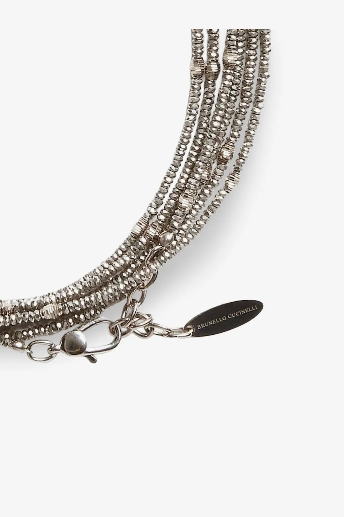 Silver beaded multi-strand necklace with a sleek textured design and branded tag complementing brunello cucinelli grey bracelet