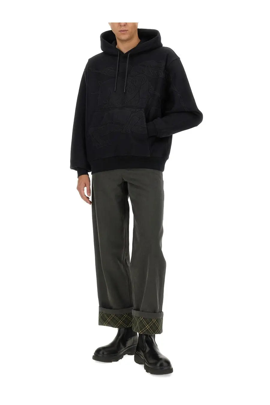 Black oversized hoodie with subtle textured pattern and ribbed cuffs paired with burberry men’s grey carpenter pants