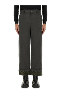 Burberry men’s carpenter pants grey featuring dark gray wide-leg trousers with subtle plaid cuffs detail