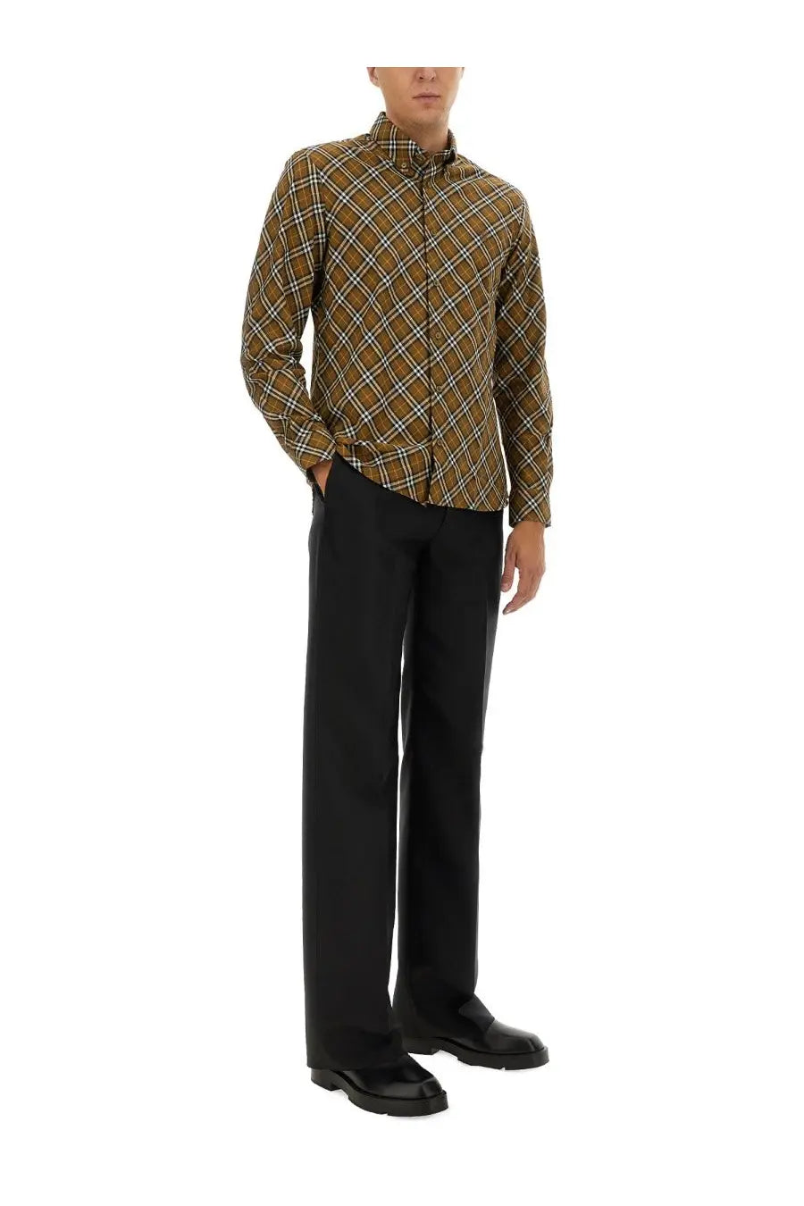 A man wearing a burberry men’s check shirt in multicolor plaid pattern with brown and beige tones long-sleeved button-up