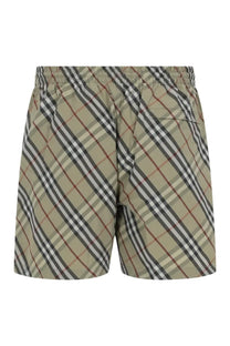 Burberry men’s check swimsuit green beige and black diagonal striped swim trunks with elastic waistband and red accent