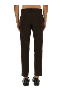 Burberry men’s dark brown cotton chino pants with tailored straight-leg cut and subtle stitching details