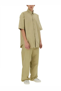 Beige burberry men’s cotton shirt with short sleeves, relaxed fit, and subtle front pleats