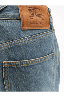 Back view of burberry men’s dexter blue denim jeans with a brown leather patch featuring the knight logo and brand name
