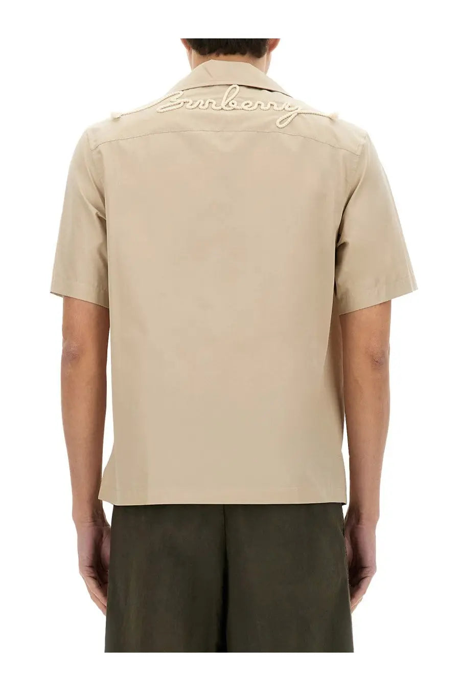 Beige short-sleeved Burberry men’s Havana shirt with cream embroidered Burberry logo across the collar