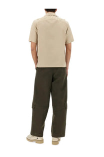Back side of beige burberry men’s havana shirt with embroidered logo on short-sleeved collar