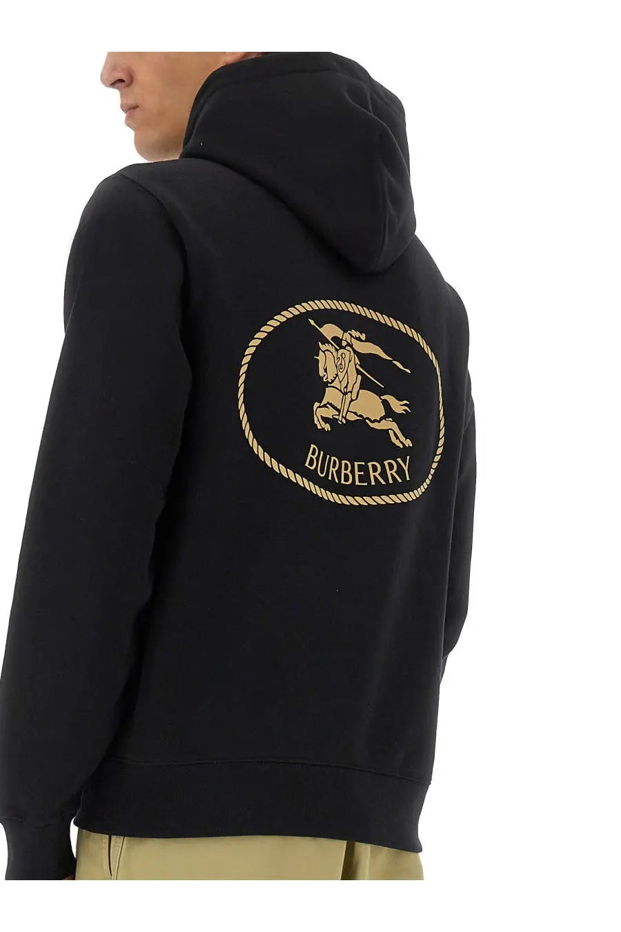 Black Burberry men’s hoodie featuring a gold embroidered horse and rider logo within an oval rope border