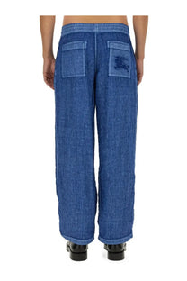 Burberry men’s blue linen pants with relaxed fit elastic waistband and patch pockets featuring embroidered logo