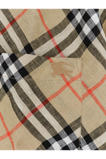 Beige burberry men’s linen shirt with black white and red plaid fabric and subtle embroidered logo on pocket