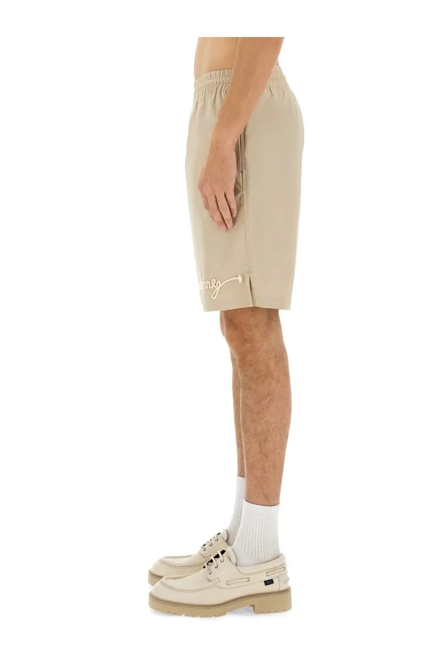 Beige Burberry men’s nautical style athletic shorts with subtle embroidered logo on the lower leg