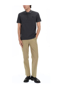 Dark gray polo shirt with subtle embroidered logo on left chest paired with burberry men’s pantalone arthur beige pants