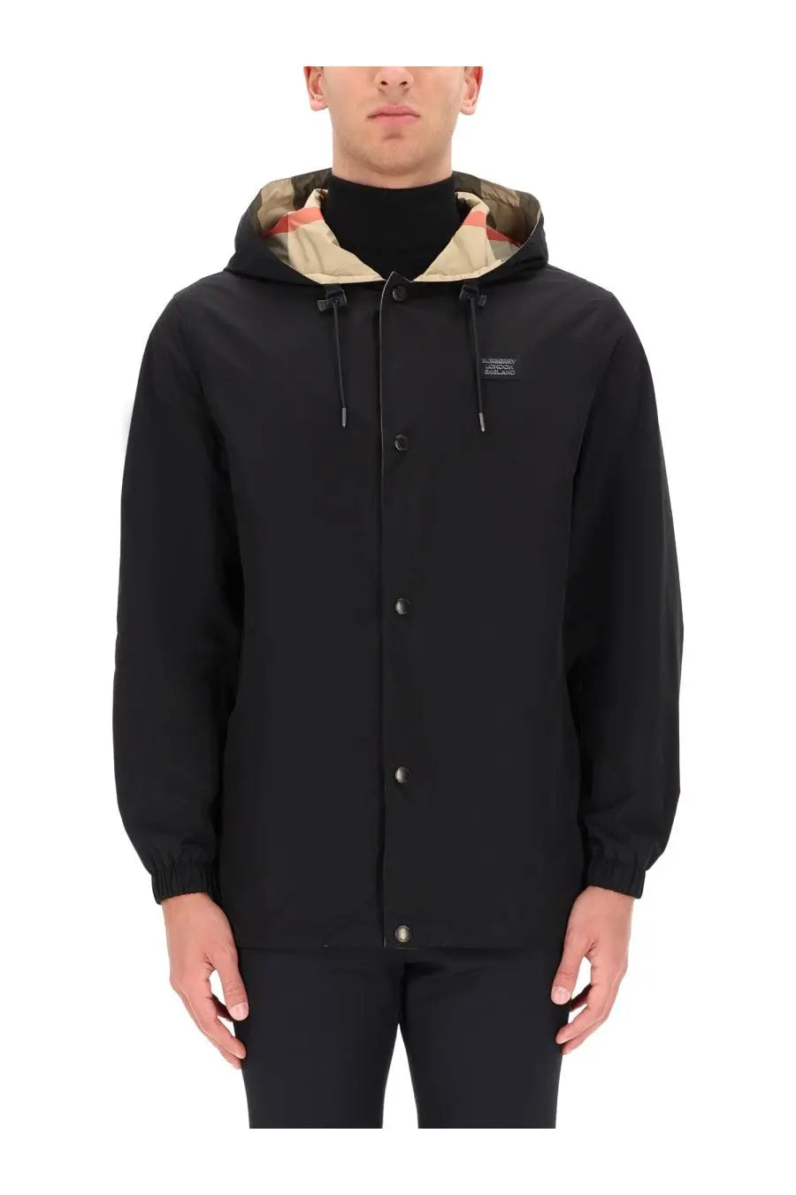 Burberry men’s reversible check jacket black with a black hooded exterior and camouflage interior lining with button closures