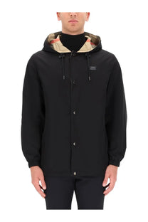 Burberry men’s reversible check jacket black with a black hooded exterior and camouflage interior lining with button closures