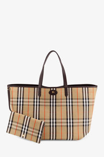 Beige and black checkered canvas burberry men’s reversible shopping bag with brown leather handles and gold-tone logo clasp