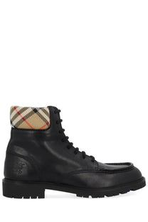 Burberry men’s rogue black leather boot with beige red and black checkered lining at the collar