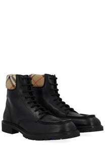 Burberry men’s rogue black leather combat boots with distinctive beige red and black checkered collar lining
