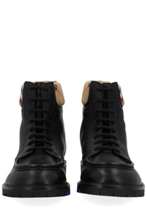 Burberry men’s rogue black leather high-top boots with beige and red checkered lining at the collar