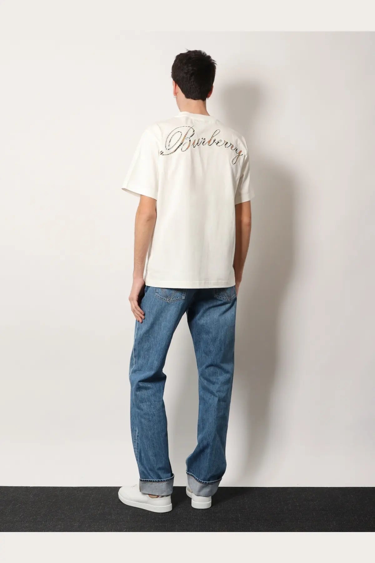 Burberry men’s white organic cotton shirt showing off-white back with silver cursive embroidered logo