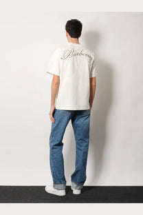 Burberry men’s white organic cotton shirt showing off-white back with silver cursive embroidered logo