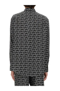 Burberry men’s black long-sleeved button-up shirt with repeating white geometric pattern in cotton fabric