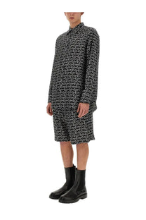 Burberry men’s black shirt dress with long sleeves collar and black and white patterned fabric visible from the front