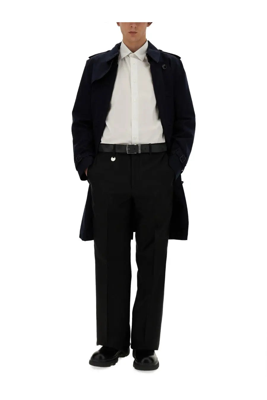 Black trench coat with structured collar and epaulets paired with burberry men’s tailored black pants