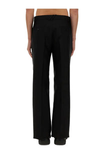 Burberry men’s tailored black trousers with straight-leg cut and subtle pleats at the back shown from behind