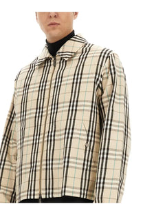 Burberry men’s vintage check beige bomber jacket with black plaid and subtle teal accents in lightweight fabric