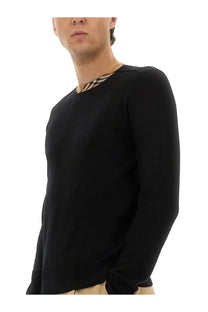 Burberry men’s black wool jersey sweater with long sleeves and a distinctive check-patterned collar