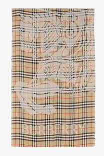 Beige Burberry men’s wool and silk blend scarf with black white and red plaid and large embroidered crest design