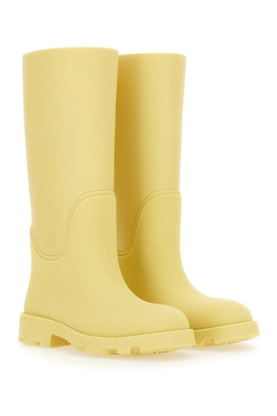 Pair of Burberry women’s marsh yellow rubber boots with textured surface and chunky sole for outdoor wear