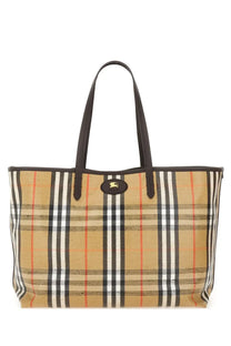 Burberry women’s borsa spalla tote in beige plaid canvas with black leather handles and gold-tone logo plaque