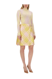Burberry women’s multicolor pastel pink and yellow plaid wrap skirt with metallic buckle at the waist