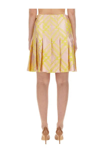 Burberry women’s pleated skirt in vibrant yellow and soft pink geometric pattern made from shiny satin fabric