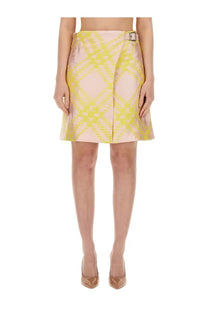 Burberry women’s multicolor check pattern mini skirt with vibrant yellow and pink geometric design and metallic belt buckle