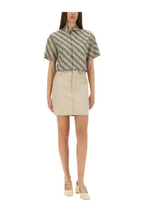 Beige denim mini skirt by Burberry with front zipper and button closure for women