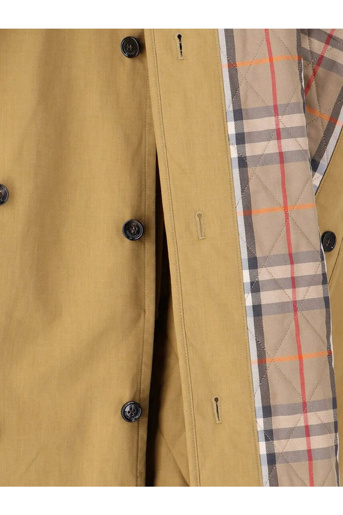 Burberry women’s Fitzrovia trench coat in tan with black buttons and quilted interior featuring Burberry check pattern