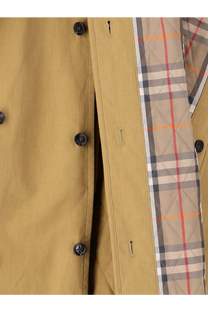 Burberry women’s Fitzrovia trench coat in tan with black buttons and quilted interior featuring Burberry check pattern