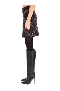 Burberry women’s Ginny skirt brown plaid mini skirt with fitted waist flared hem and white gray checkered pattern