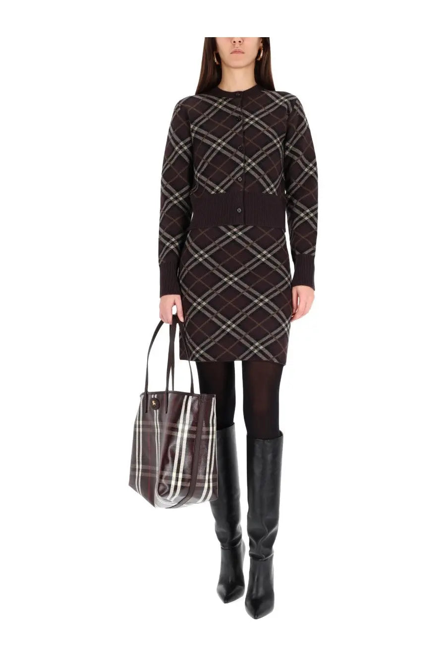 Brown and white plaid Burberry tote bag with black handles alongside women’s Ginny skirt brown