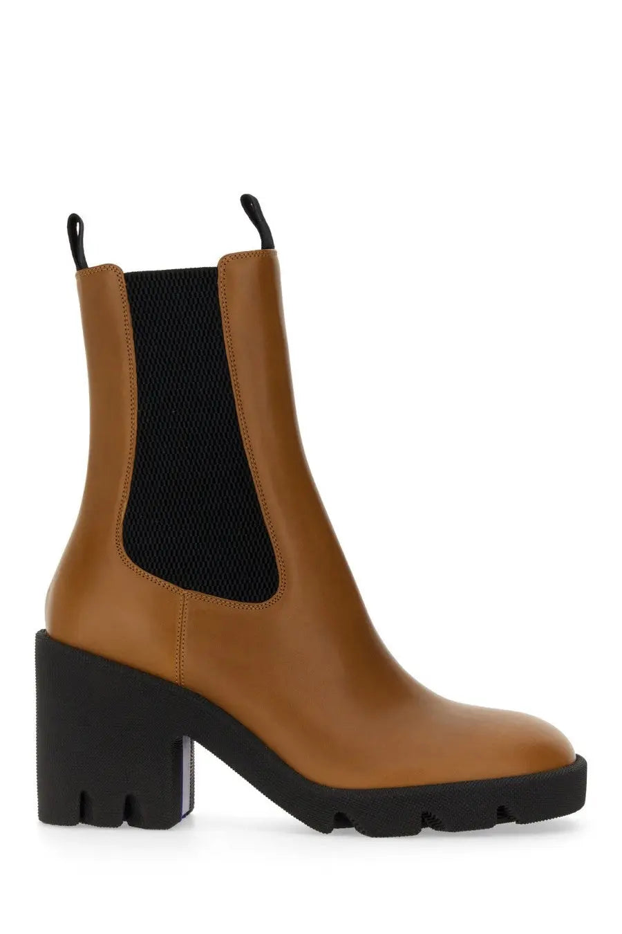 Burberry women’s beige leather chelsea boot with tan leather, black rubber heel, chunky sole, and black elastic panel