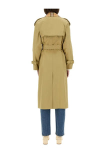 Burberry women’s beige long Castleford trench coat featuring a tan belted design and check-patterned collar