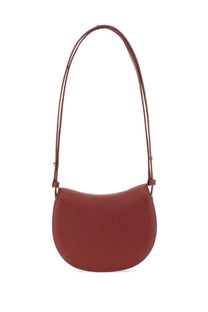 Burberry women’s mini rocking horse shoulder bag in rust-colored sleek leather with a minimalist design and adjustable strap