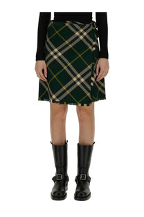 Burberry women’s mini wrap skirt in dark green black and cream plaid with frayed hem perfect for casual wear