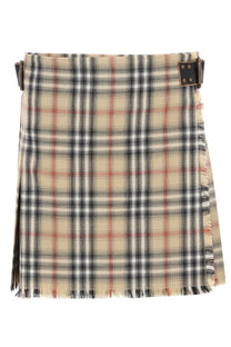 Burberry women’s minigonna kilt in lana check multicolor with beige black white and red plaid tartan and frayed hem